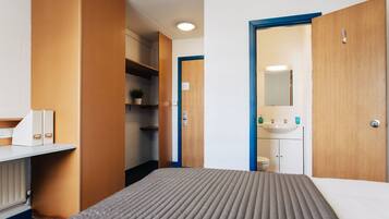 Desk, laptop workspace, free WiFi, bed sheets