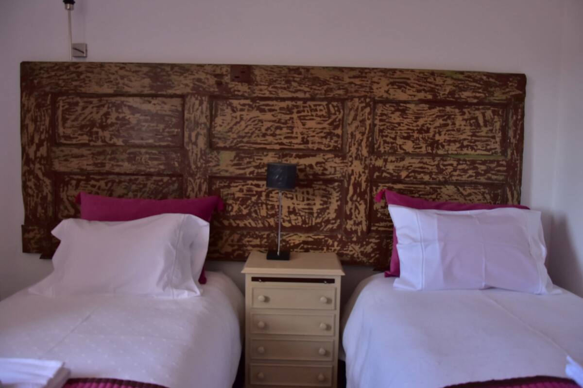 Individually decorated, individually furnished, desk, rollaway beds