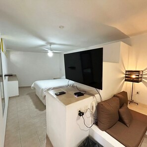 Executive Apartment, 1 Queen Bed, Refrigerator & Microwave | Living room | 40-inch TV with digital channels