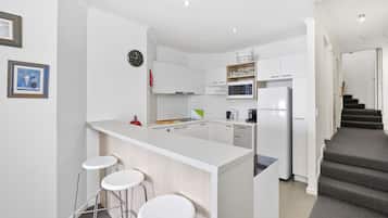 Penthouse, 2 Bedrooms | Private kitchen | Full-sized fridge, microwave, oven, stovetop