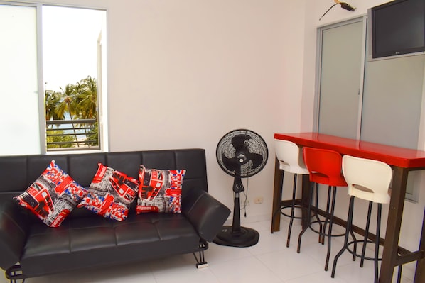 Family Studio, 1 Bedroom, Kitchenette, Beachfront | Living area | TV
