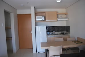 Apartment | Private kitchen | Fridge, microwave, stovetop, cookware/dishes/utensils