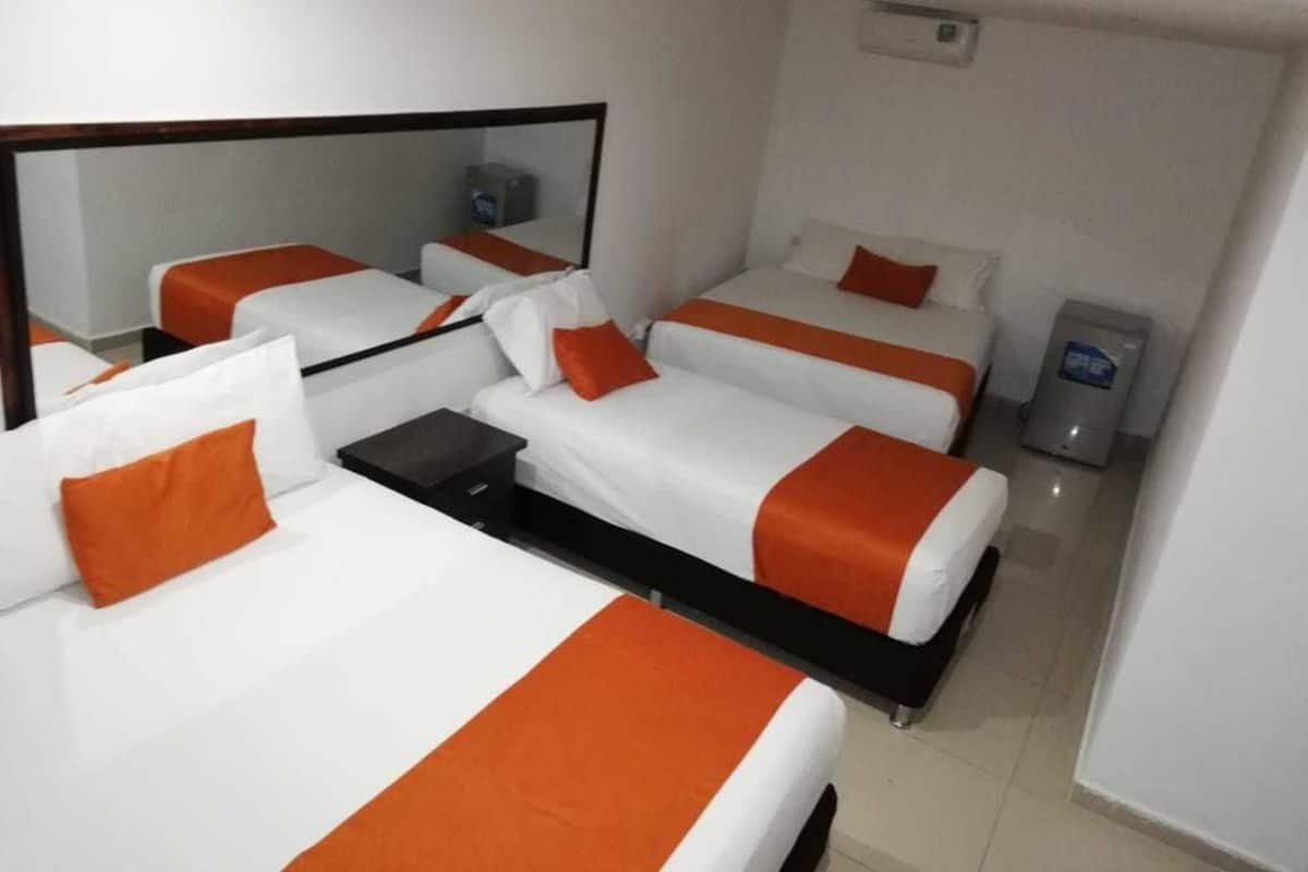 Triple Room | Minibar, in-room safe, desk, iron/ironing board