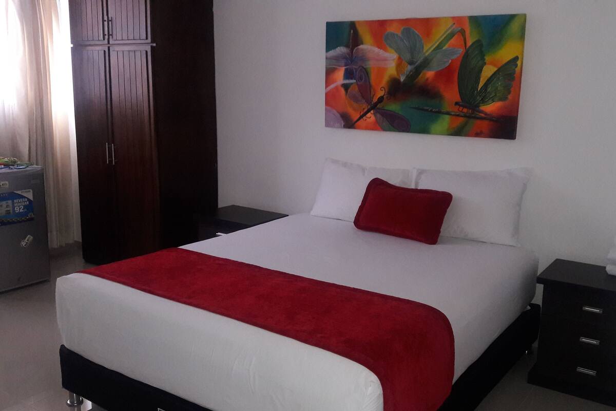 Economy Double Room | Minibar, in-room safe, desk, iron/ironing board