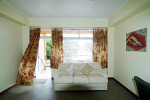 Suite, Ensuite | Living area | Flat-screen TV