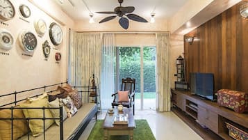 Boutique Homestay | Living room | 32-inch flat-screen TV with satellite channels, TV, DVD player