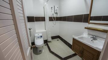 Shower, free toiletries, hair dryer, slippers