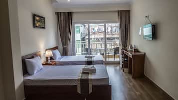 Minibar, desk, bed sheets