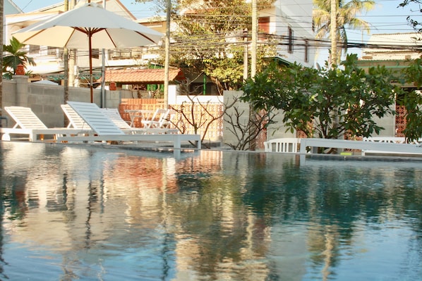 Outdoor pool, pool umbrellas, pool loungers