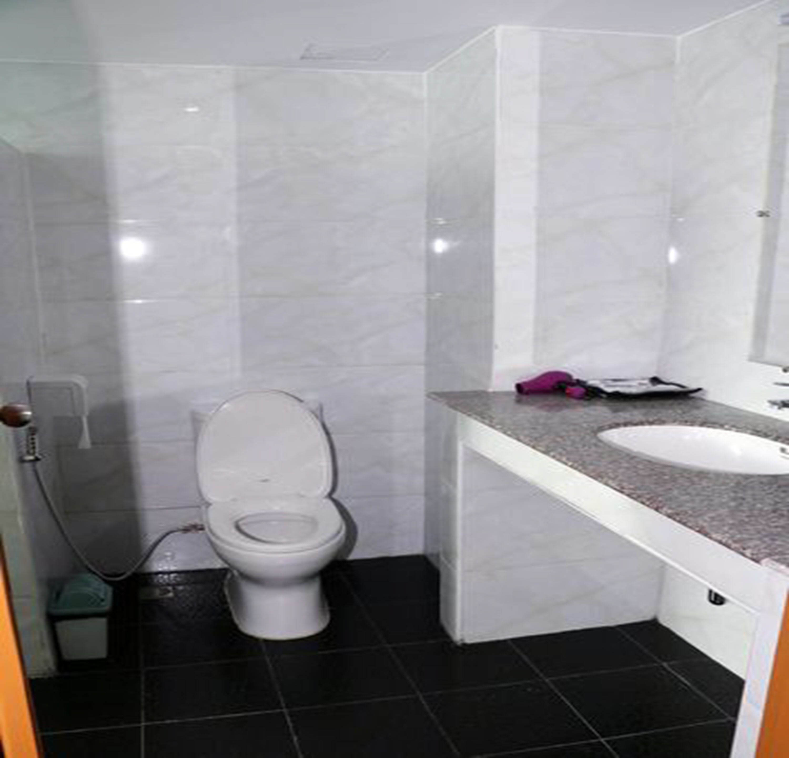 deep-soaking bathtub, rainfall showerhead, free toiletries, towels