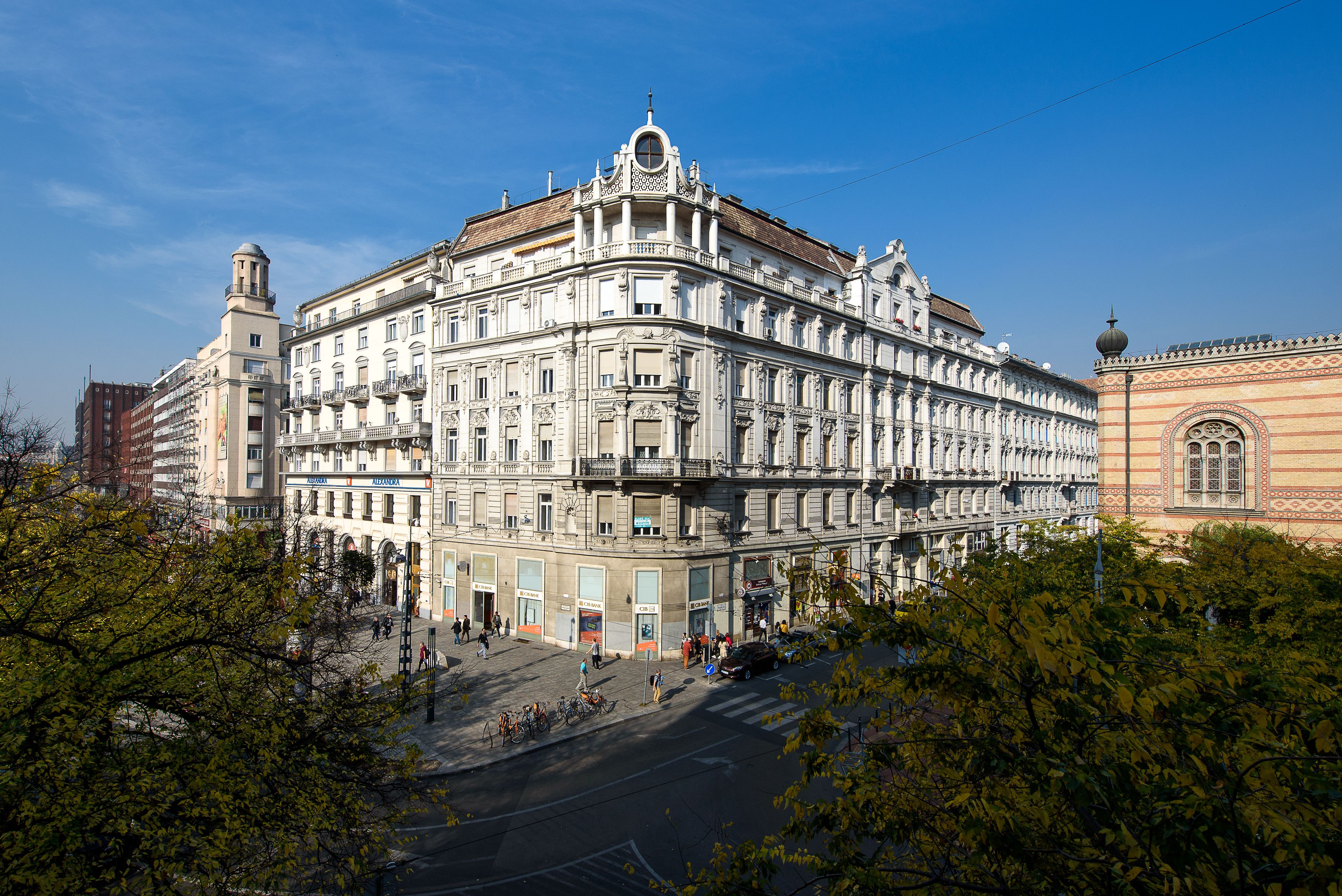 A historic building with classical architecture, featuring a prominent dome and detailed facade.