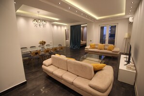Superior Suite, 4 Bedrooms, Balcony | Living area | Flat-screen TV - Maxela Apartments (Tbilisi)