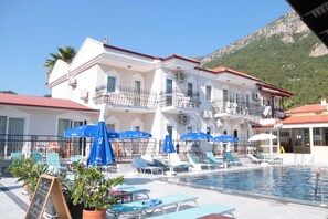 Outdoor pool, pool umbrellas, sun loungers