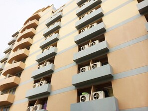 A multi-story building with balconies and air conditioning units. - Grand Living Place (Bangkok)