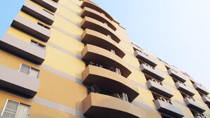 A multi-story building with balconies on each floor. - Grand Living Place (Bangkok)