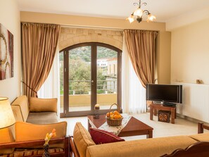 Apartment (Artemis) | Living area | 32-inch TV with satellite channels - Xristinas Apartments (Platanias)