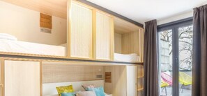 Family Room, Private Bathroom (Deluxe) | Blackout drapes, soundproofing, free WiFi, bed sheets