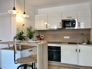 Double bed attic studio apartment | Private kitchen