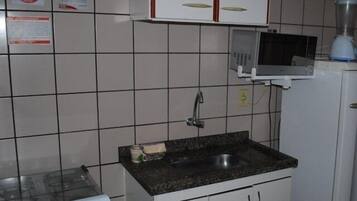 Apartment | Private kitchen | Fridge, microwave, stovetop, cookware/dishes/utensils