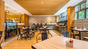 A restaurant with wooden ceiling, brick walls, and large windows. - KALI Ciudadela Mexico City (Mexico City)