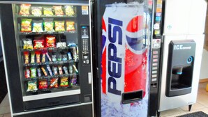 A vending machine with a Pepsi logo and an ice dispenser. - Courtesy Inn (Oklahoma City)