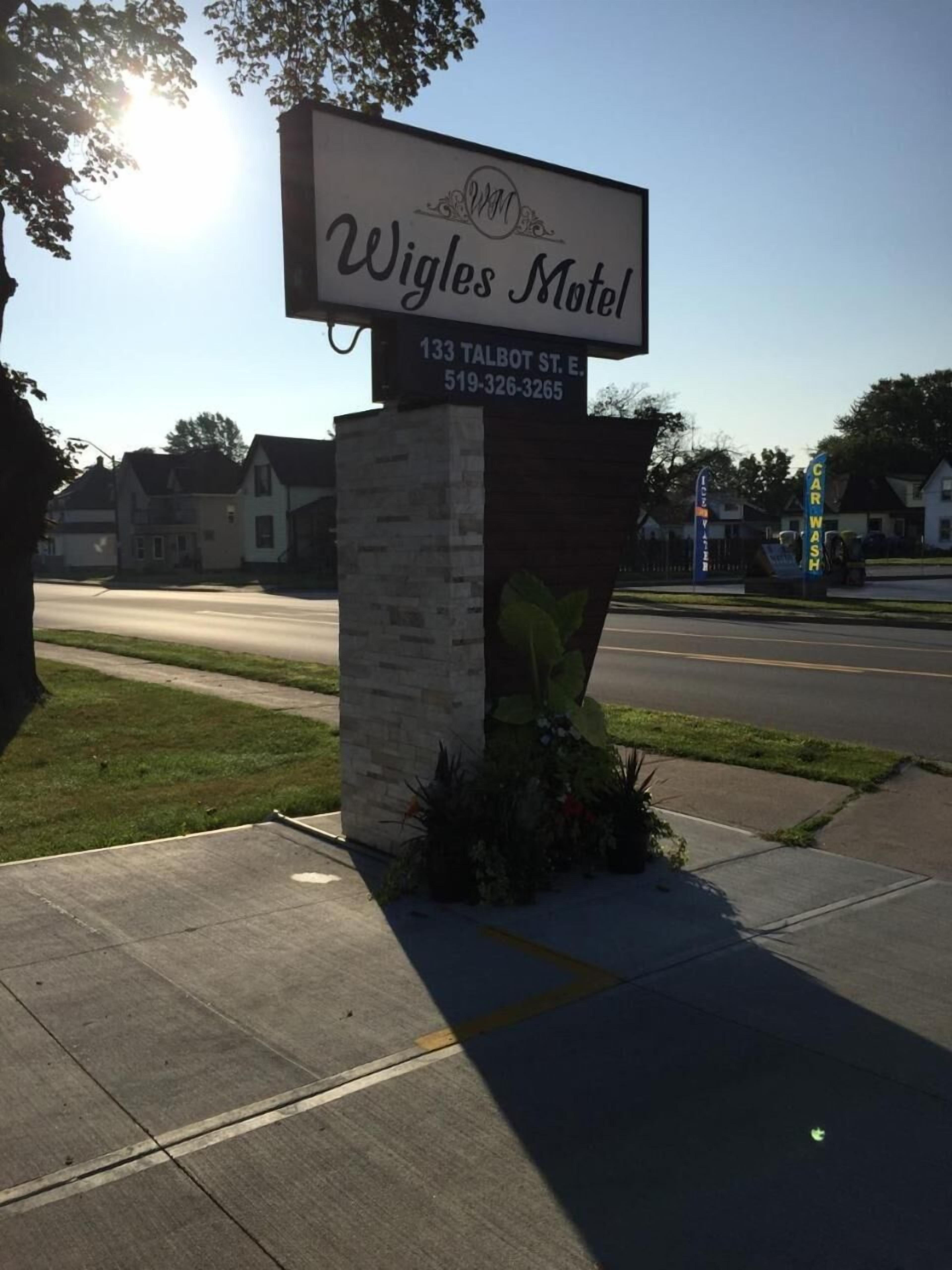 A sign for Wigles Motel with the address 133 Talbot St. E. and a phone number 519-326-3265.