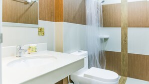 A bathroom with a white sink, a toilet, and a shower with a curtain. - Sunset Residence Pinklao (Bangkok)