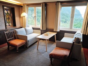 Deluxe-Doppelzimmer, 1 King-Bett, Meerblick, zum Garten hin | Wohnbereich