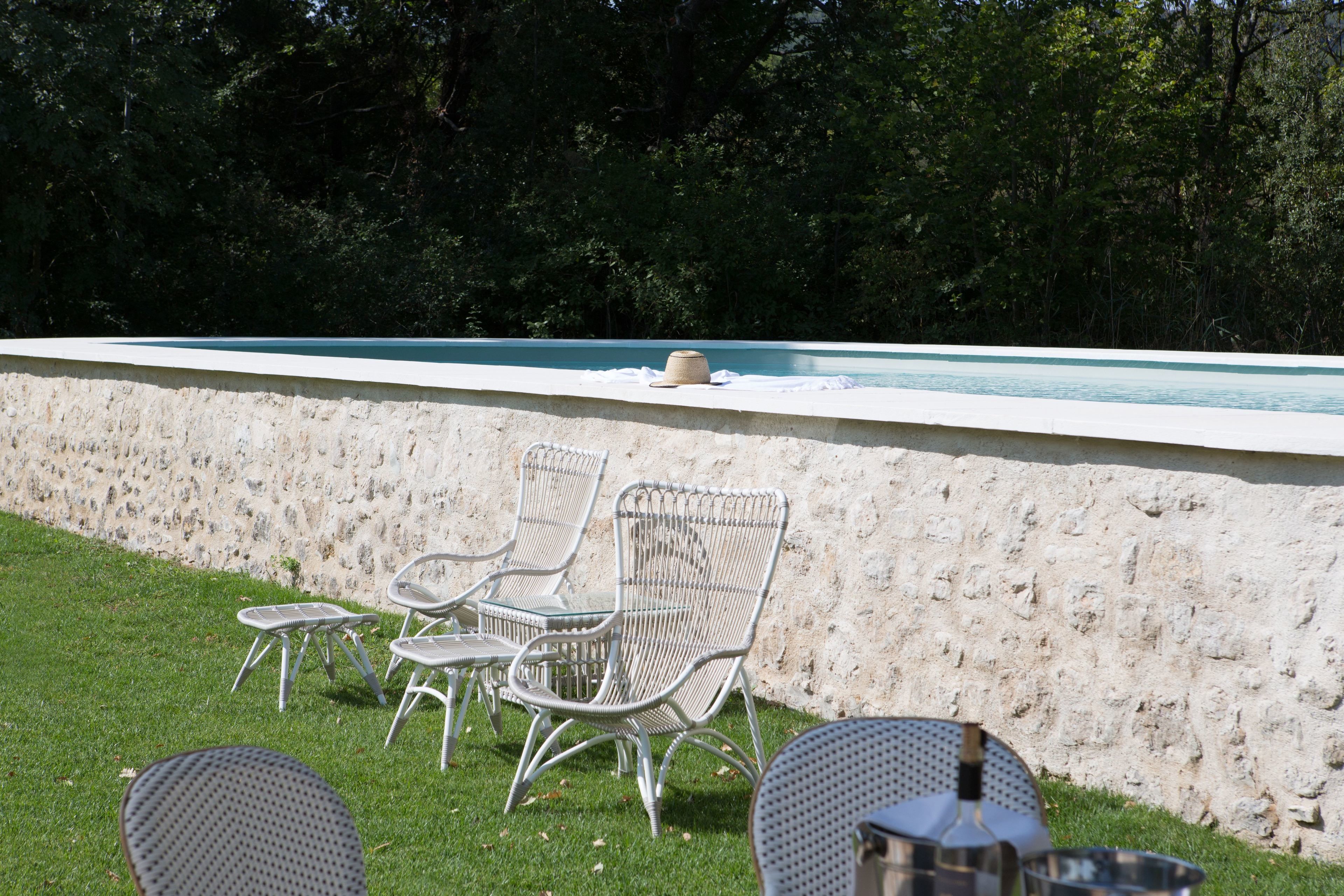 Seasonal outdoor pool, open 8:00 AM to 8:00 PM, pool loungers
