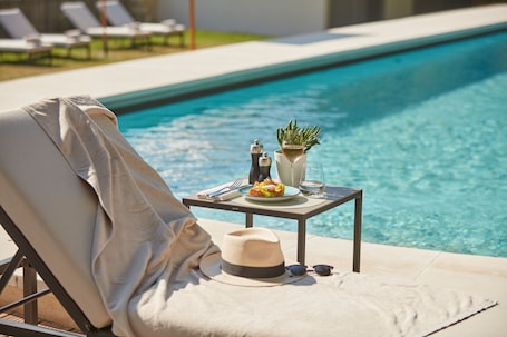Seasonal outdoor pool, open 8:00 AM to 9:00 PM, sun loungers