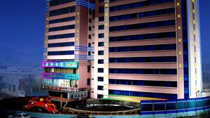 A multi-story hotel with a prominent sign at the top. - Nantian Hotel (Liuzhou)