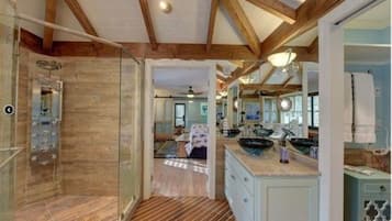 Deluxe Room, Private Bathroom (Melody's Mooring) | Bathroom | Rainfall showerhead, hair dryer, towels