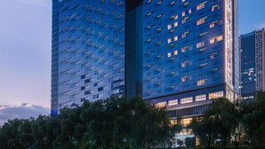 A tall, modern building with the name "SOMERSET" prominently displayed at the top. - Somerset Swan Lake Hefei (Hefei)