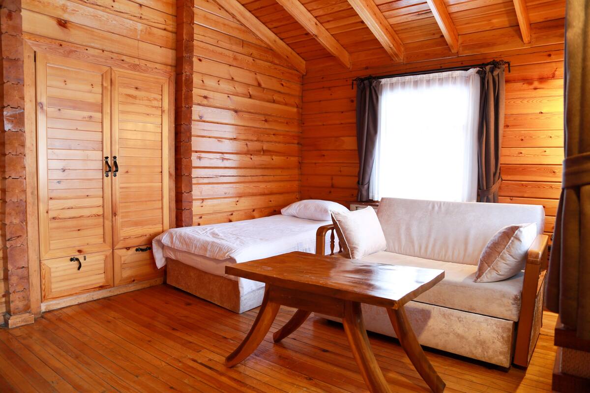 standard bungalow, 1 bedroom, balcony, mountain view | living room | lcd tv