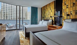 A hotel room with two beds, a large window with a city view, a balcony with outdoor furniture, and a decorative wooden panel wall. - Viceroy Chicago (Chicago)