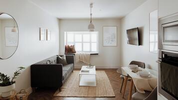 Deluxe Apartment, 1 Bedroom, Kitchen | Living area | 32-inch Smart TV with cable channels, TV, Netflix