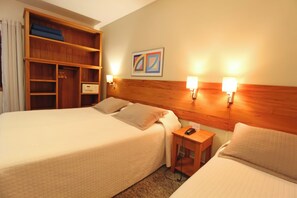 Triple Room | Minibar, in-room safe, blackout drapes, soundproofing