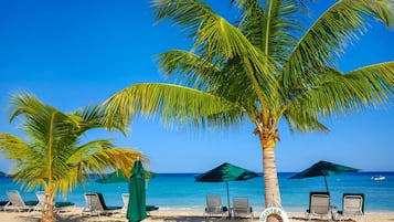 Apartment, 2 Bedrooms | Beach | On the beach, white sand, sun loungers, beach umbrellas