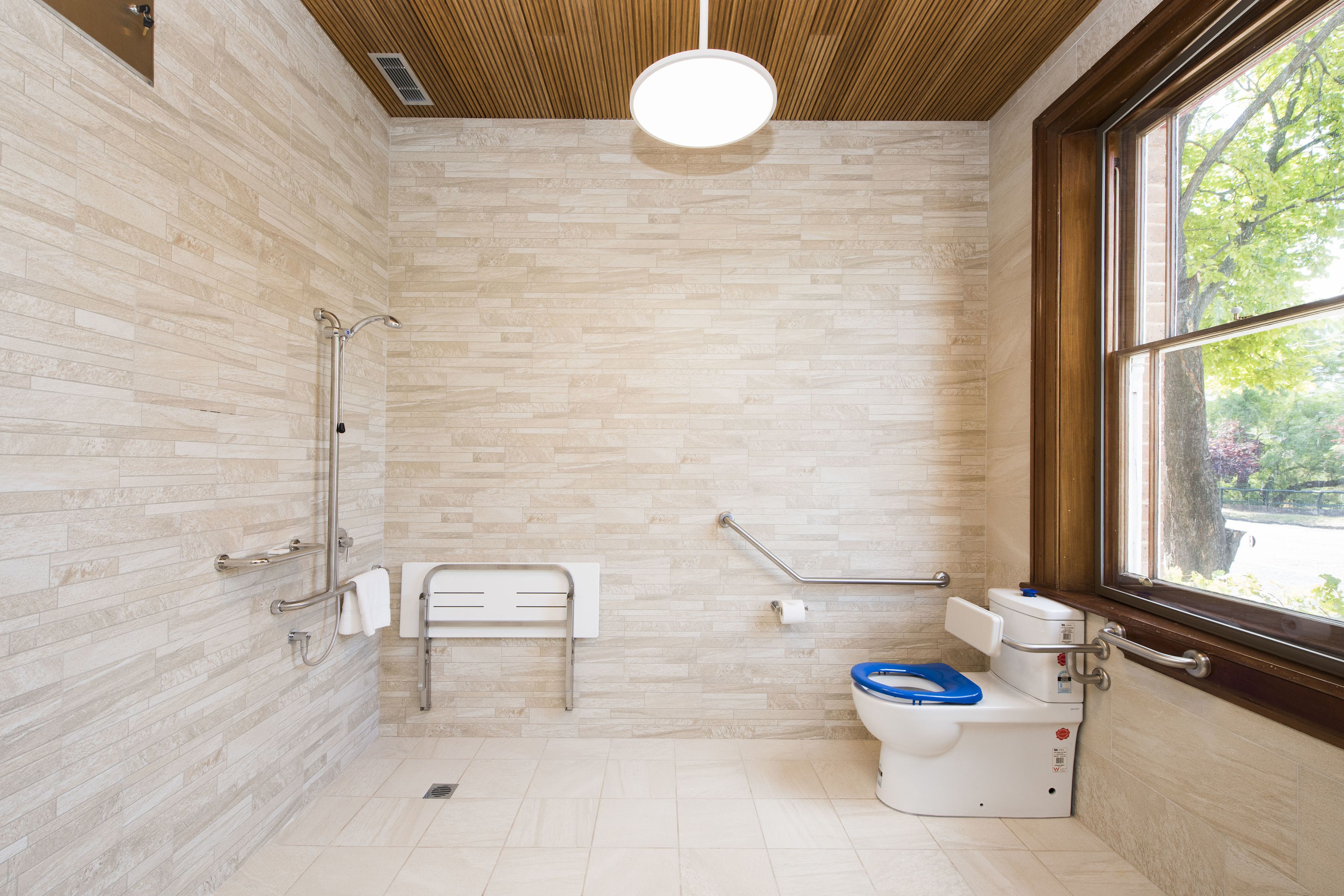 suite 5 - queen accessible suite | bathroom | rainfall showerhead, free toiletries, hair dryer, bathrobes