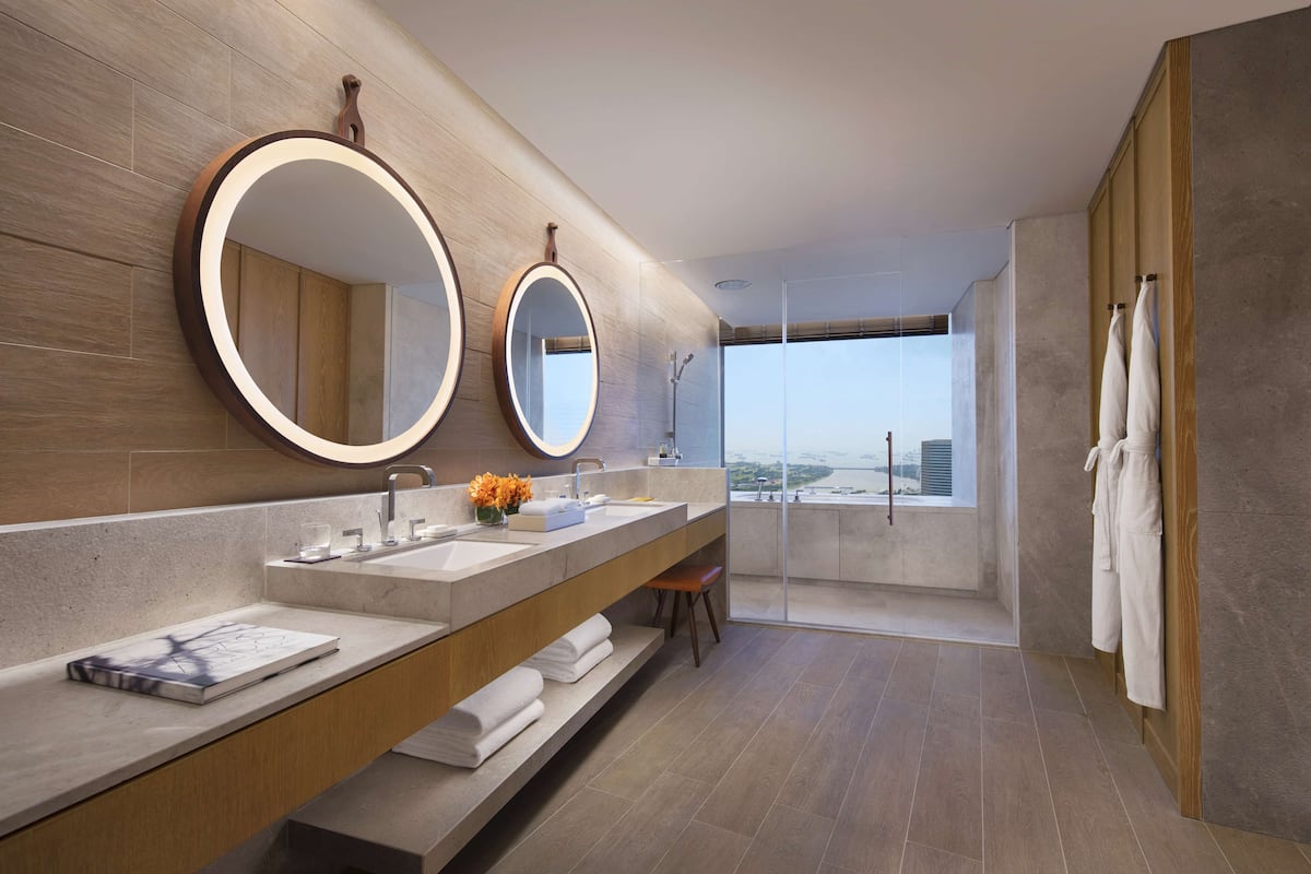 designer toiletries, hair dryer, bathrobes, slippers