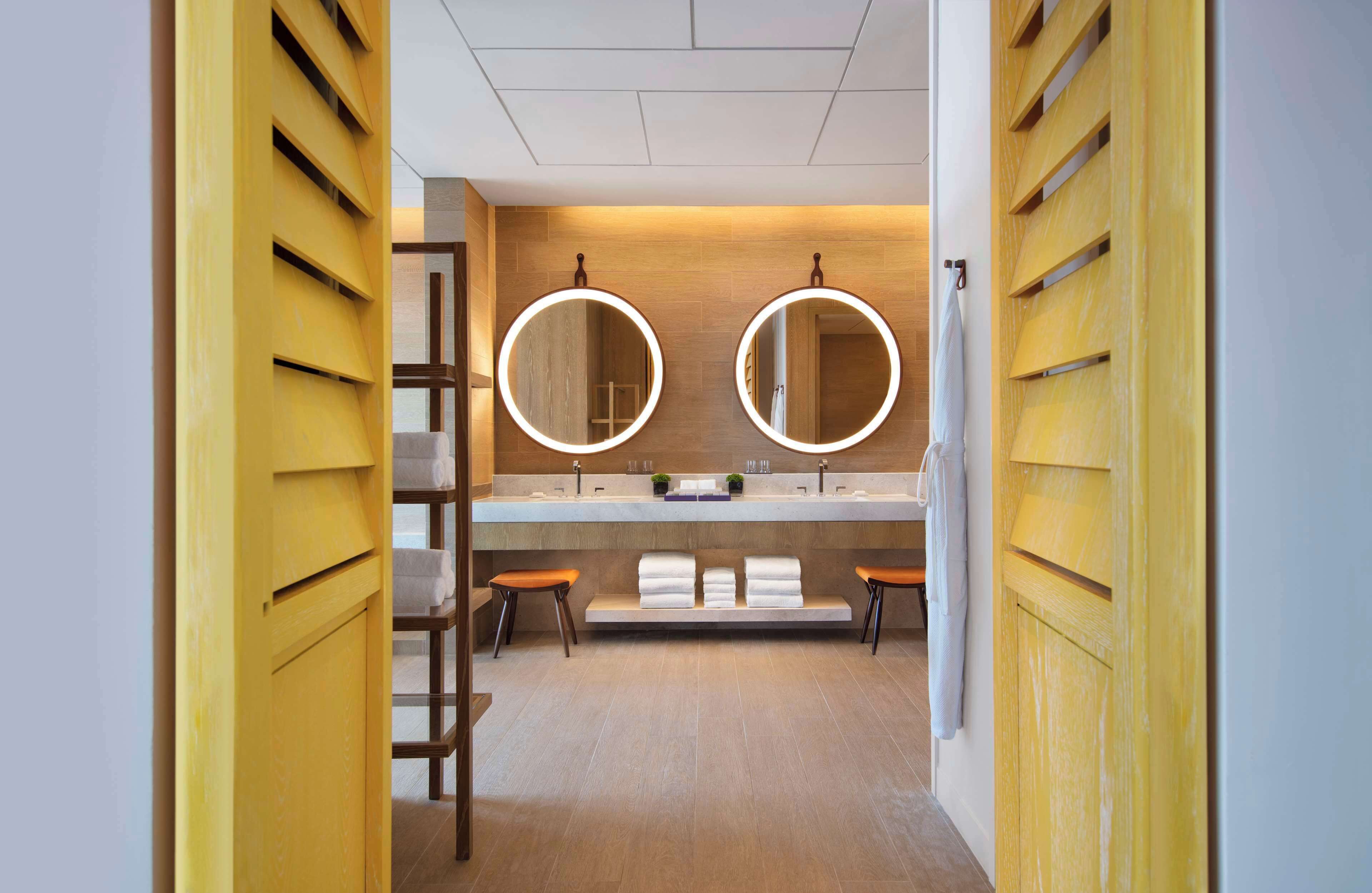 designer toiletries, hair dryer, bathrobes, slippers