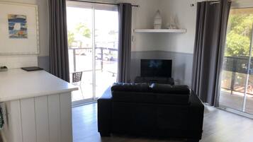 Family Room, Multiple Beds | Living area | TV