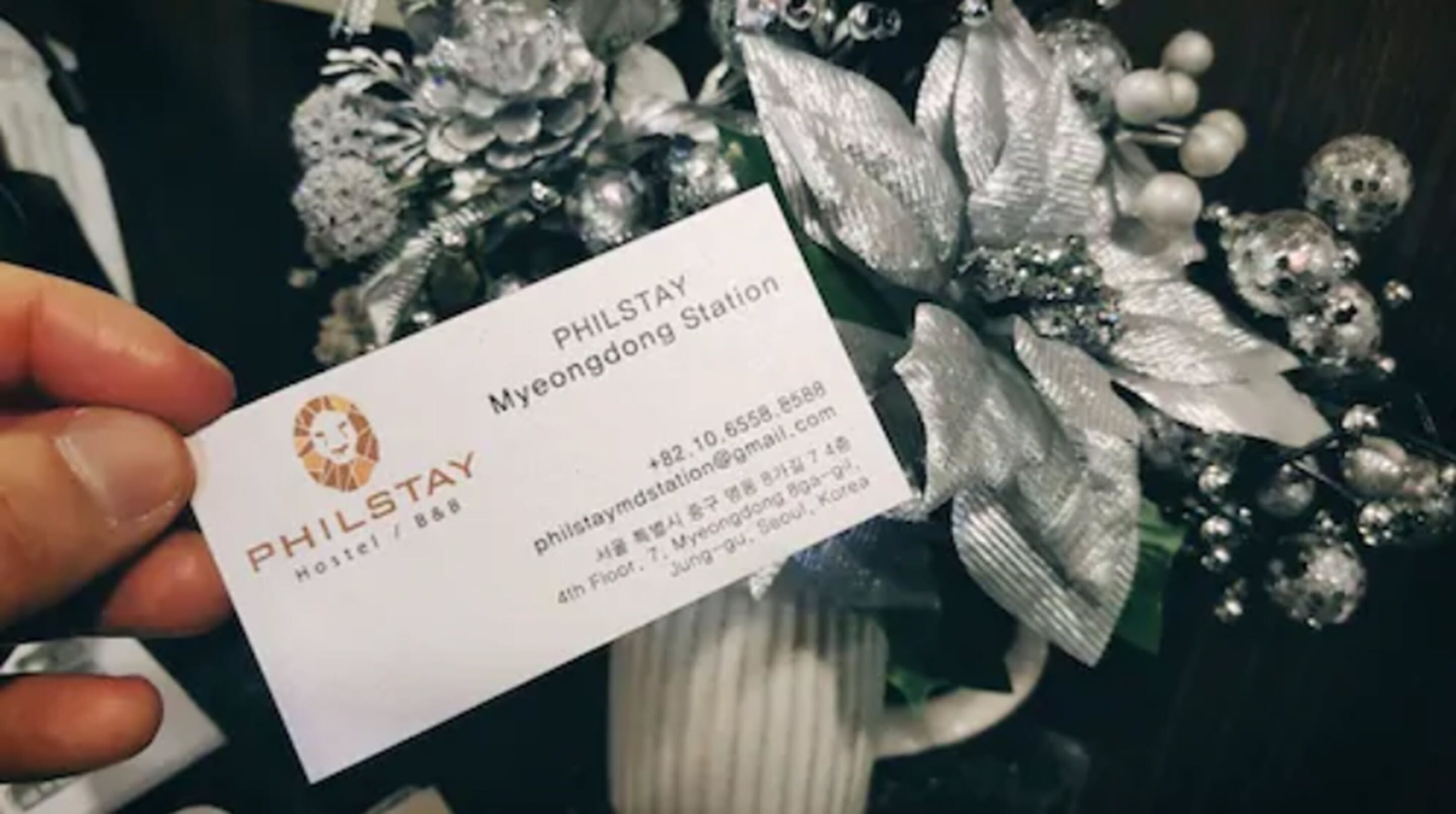 A business card for PHILSTAY Hostel in Myeongdong Station, Seoul, Korea.