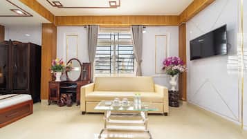 Family Apartment, 1 Bedroom, City View, Tower | Living area | 43-inch plasma TV with cable channels, TV, video game console