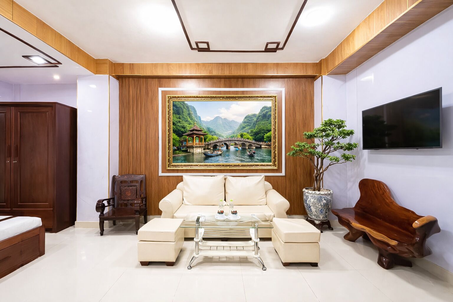 A modern living room with a sofa, coffee table, and decorative items.