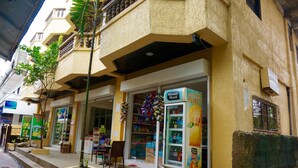 A storefront with a Minute Maid refrigerator, a small outdoor seating area, and a visible entrance. - AV Seven Resort (Boracay Island)