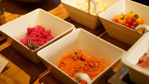 A table with four white bowls containing different food items. - Sotetsu Fresa Inn Tokyo Roppongi (Tokyo)