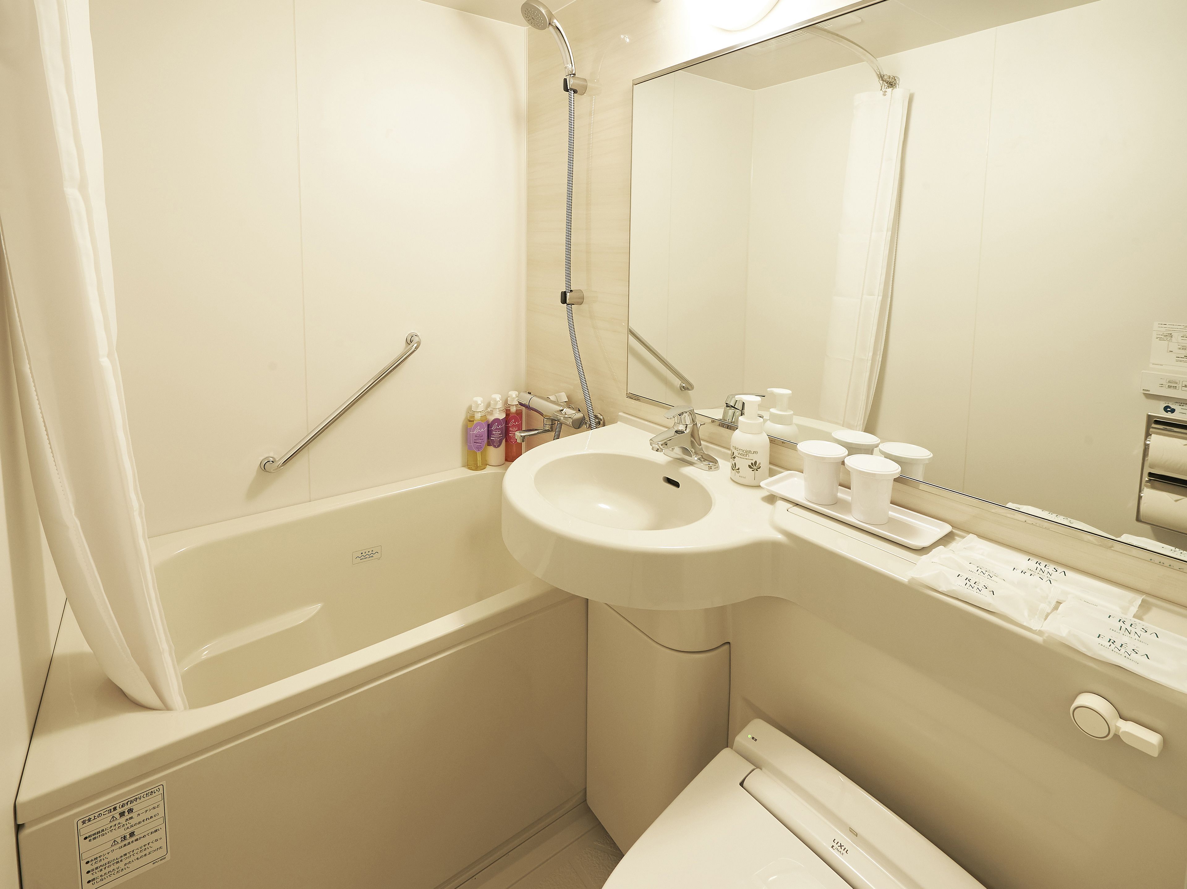 combined shower/bathtub, free toiletries, hair dryer, slippers