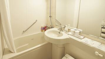 Combined shower/tub, free toiletries, hair dryer, slippers
