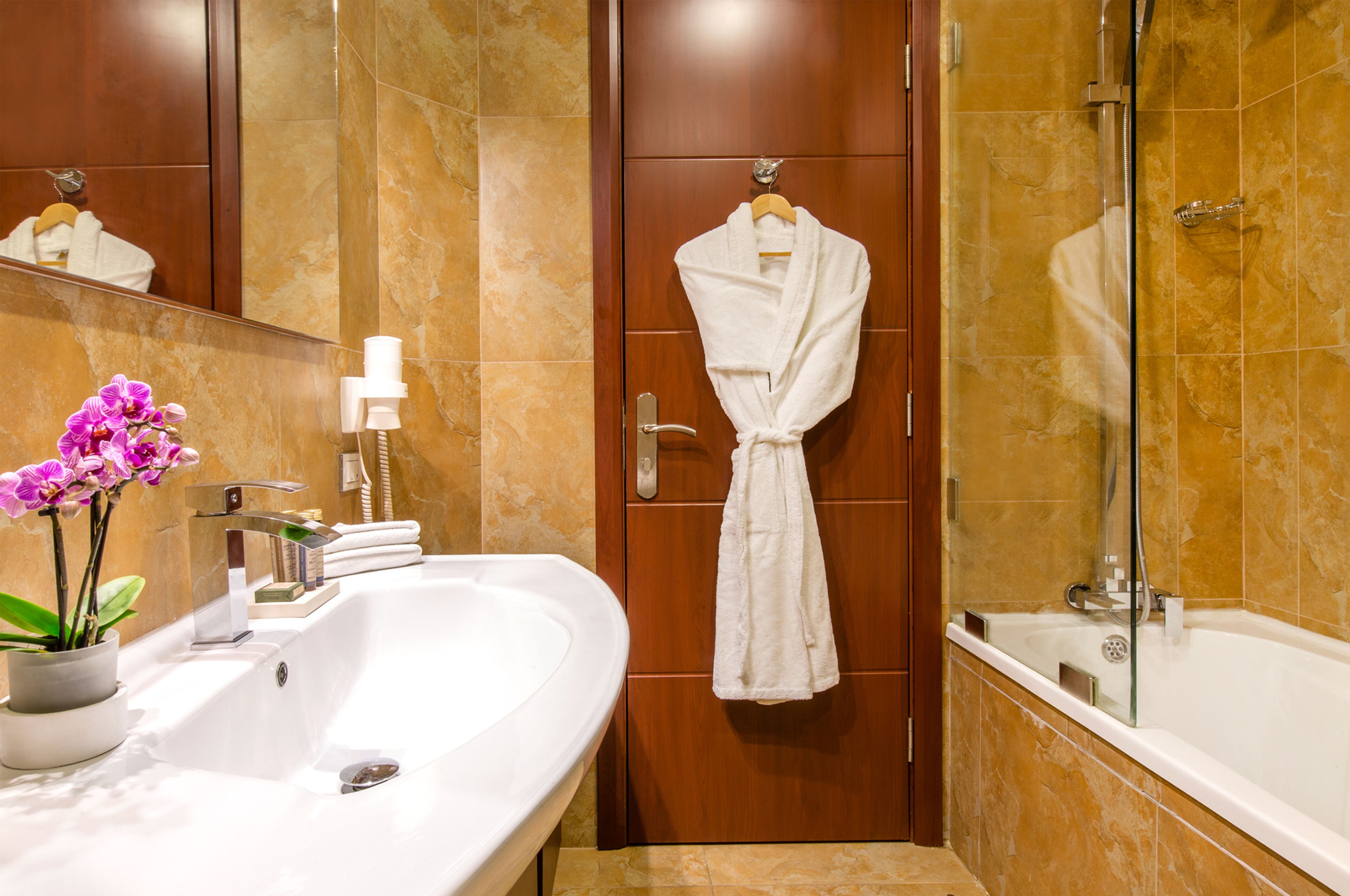 deep-soaking bathtub, free toiletries, hair dryer, bathrobes